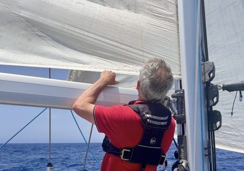 01.06.26 Peter inspects sail, cropped